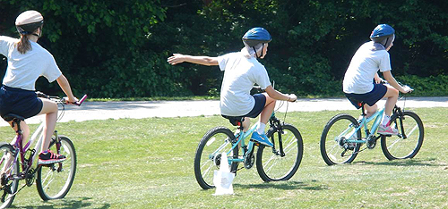 Students at Tuckahoe Middle School ride through a bicycle obstacle course during their Bike At School event.